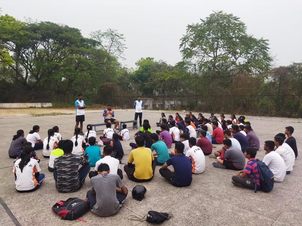 Outdoor group sport psychology session with athletes